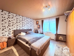 Schlafzimmer 2, EG, Bild 1 - Gepflegtes Ein-/Zweifamilienhaus mit schönem Grundstück in Baunatal-Großenritte